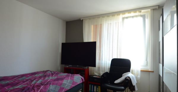 Appartement de 4.5 pièces au 1er étage, 2 balcons et garage individuel 8