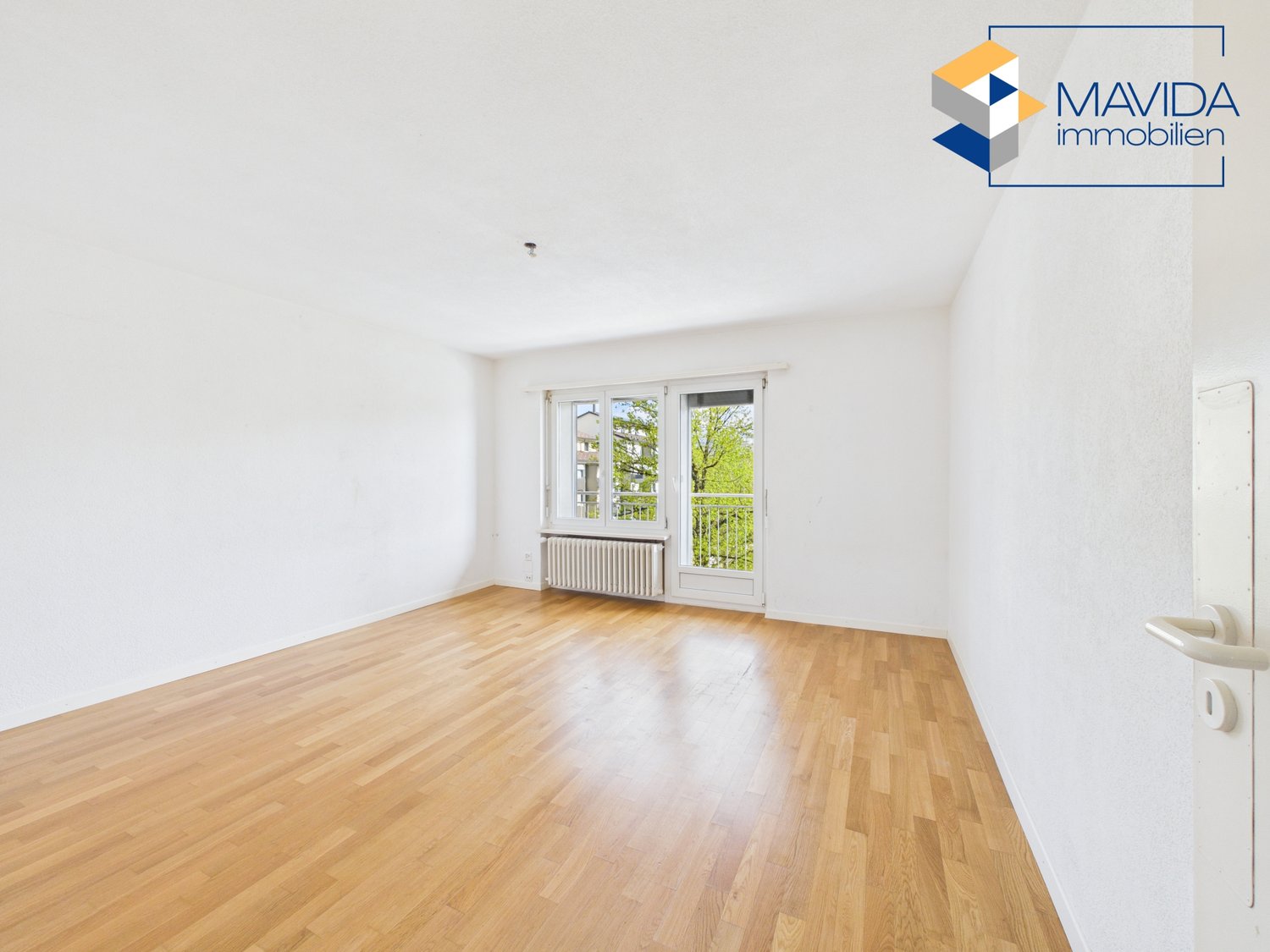 empty room, wooden floor, white walls, large window, balcony
