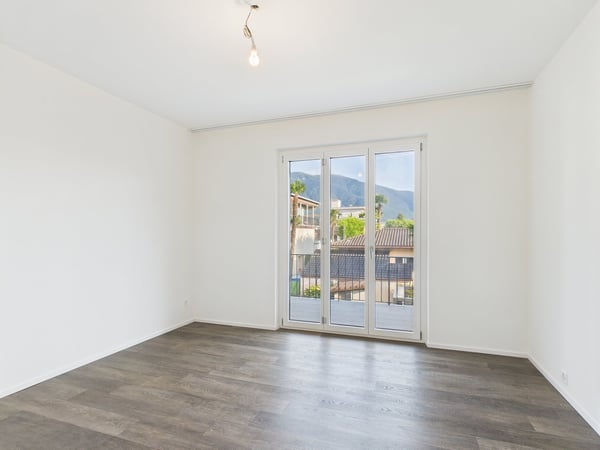 Stilvolle Obergeschosswohnung mit Cheminée und Balkon in Ascona – Luxus und mediterranes Flair 7