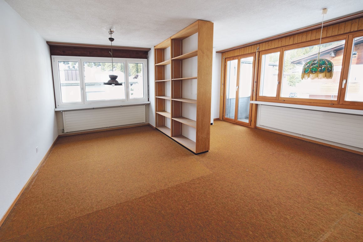 empty room, hardwood floor, large windows, a shelf, sliding door, radiators