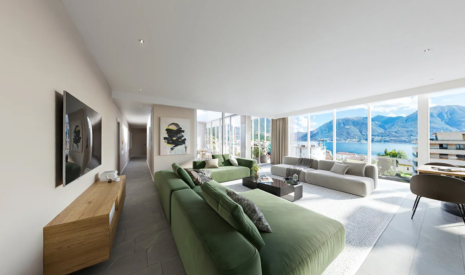 modern living room with green sofa, white rug, gray couch, coffee table, large windows, view of lake and mountains