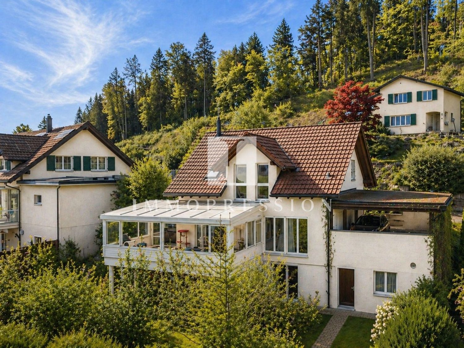 3 story house, brown roof, white walls, glass windows, balcony, surrounded by trees