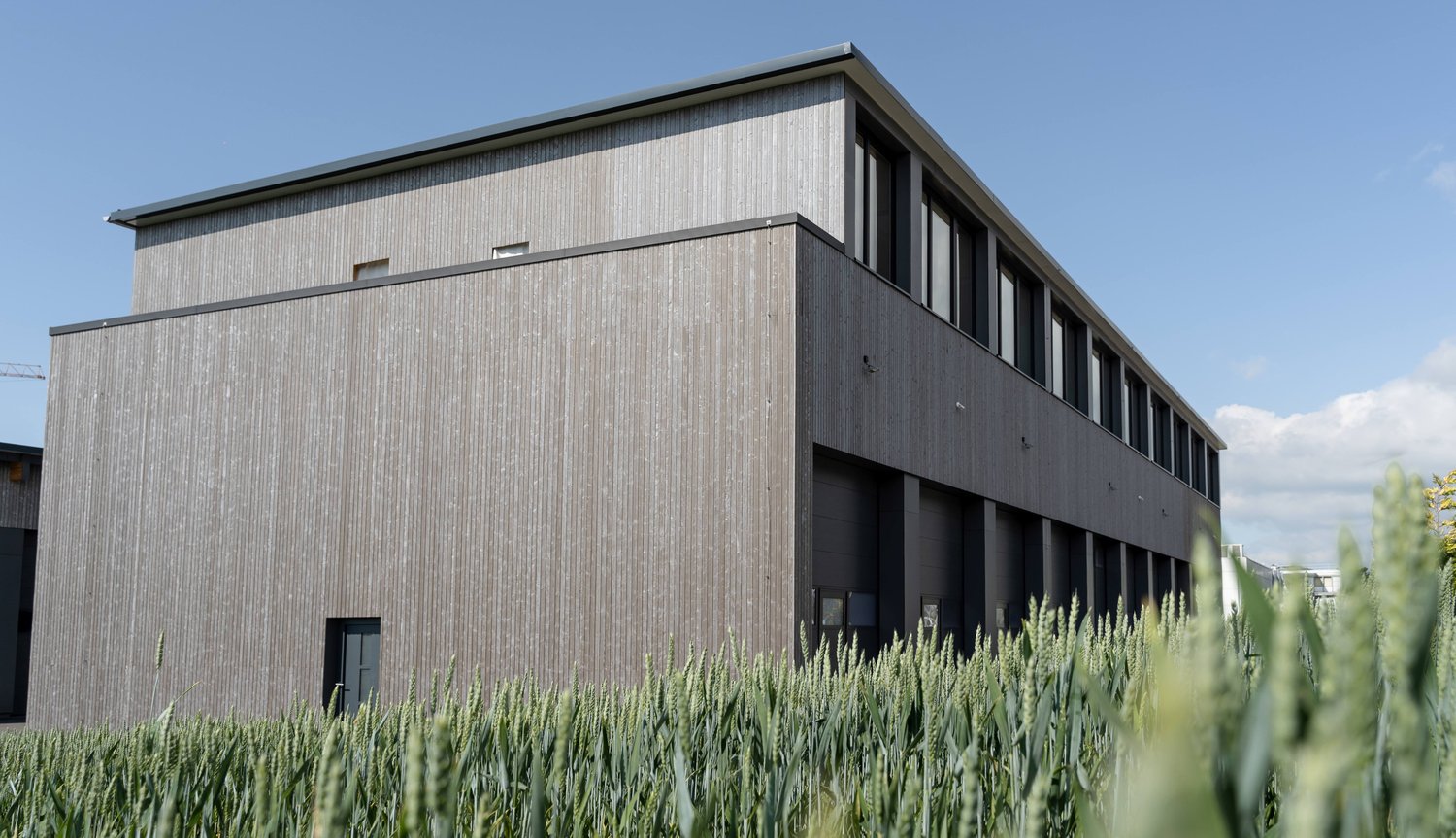 modern building, wood paneling, 2 stories, 2 garages