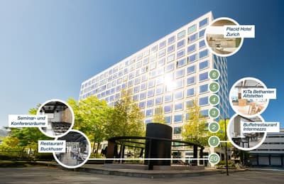 Modern multistory hotel with many windows, outdoor seating area, and labeled facilities including hotel rooms, restaurant, and seminar/conference room