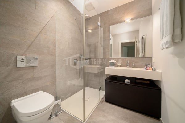 ELEGANTE APPARTAMENTO DI 4 LOCALI CON GIARDINO E VISTA LAGO 12