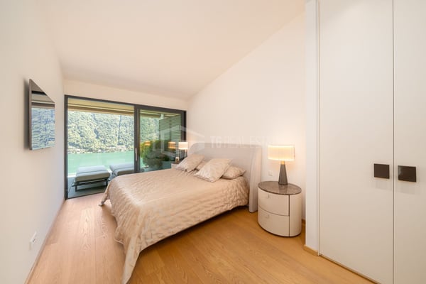 ELEGANTE APPARTAMENTO DI 4 LOCALI CON GIARDINO E VISTA LAGO 8