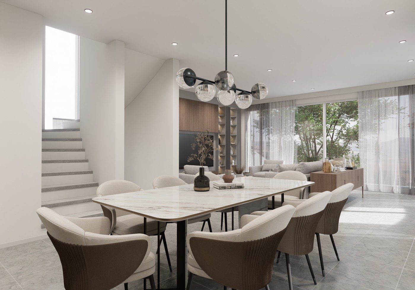 Spacious dining area with a large marble-top dining table and comfortable upholstered chairs. The room features a modern chandelier with glass globes, built-in shelving, and large windows overlooking a balcony or terrace area.