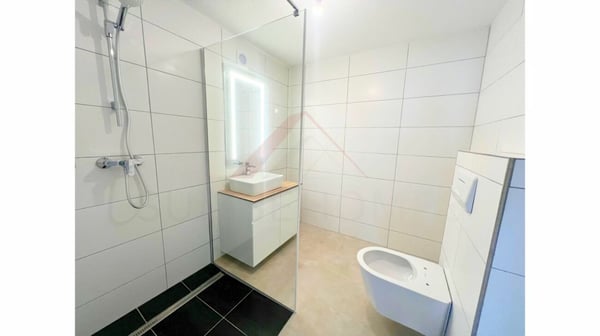 Vivre ou investir à Courrendlin - maison multifamiliale rénovée avec trois appartements lumineux 6