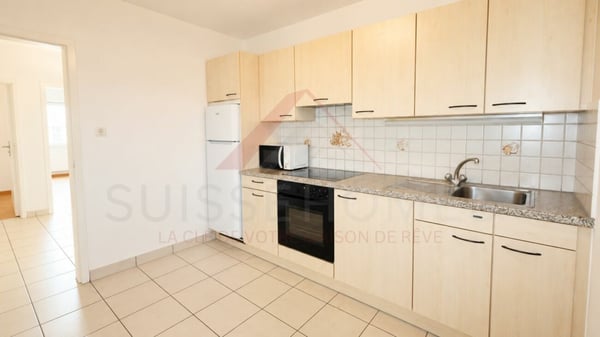 Marly - Appartement 3.5 pièces rénové avec balcon ensoleillé et vue verdoyante 13