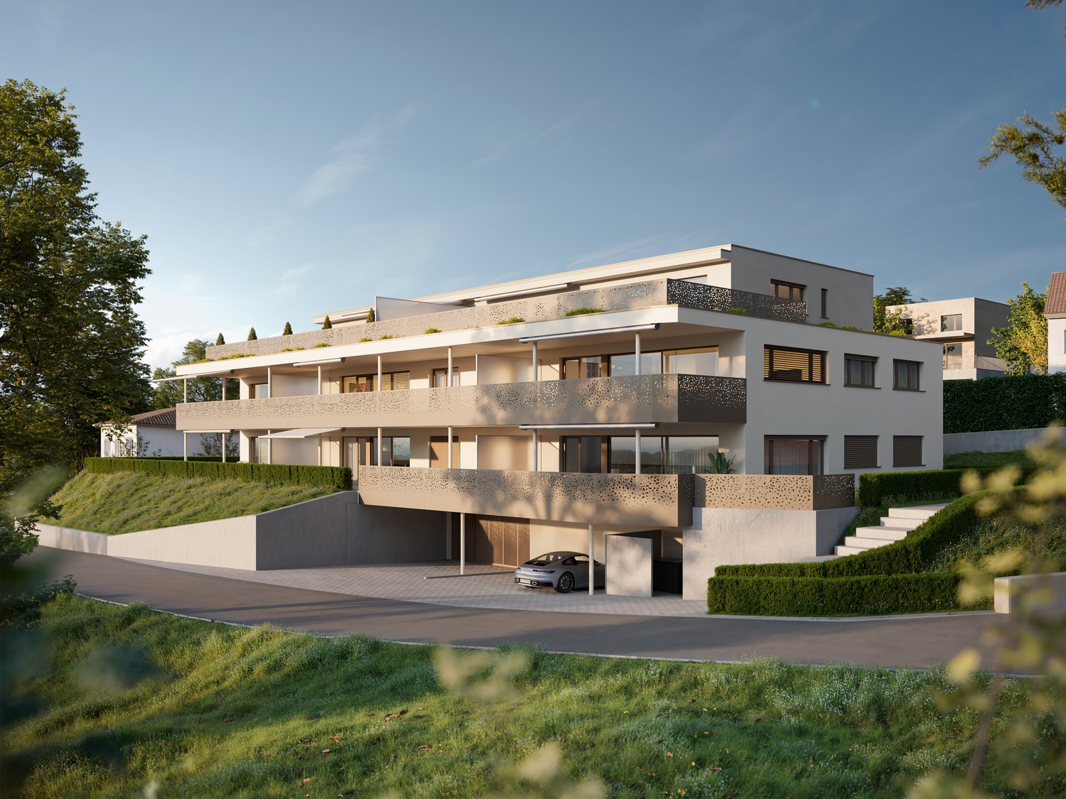 Modern building with a car parking garage under the raised ground floor, terrace on the first floor, another terrace on the second floor.