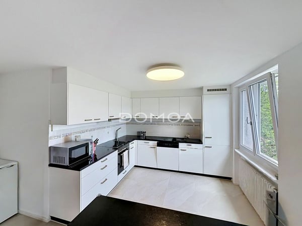 Appartement 5,5 pièces rénové avec rendement - Rez supérieur 6