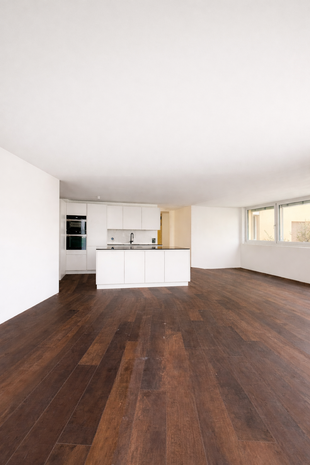 white cabinets, wooden floor, large windows, modern appliances