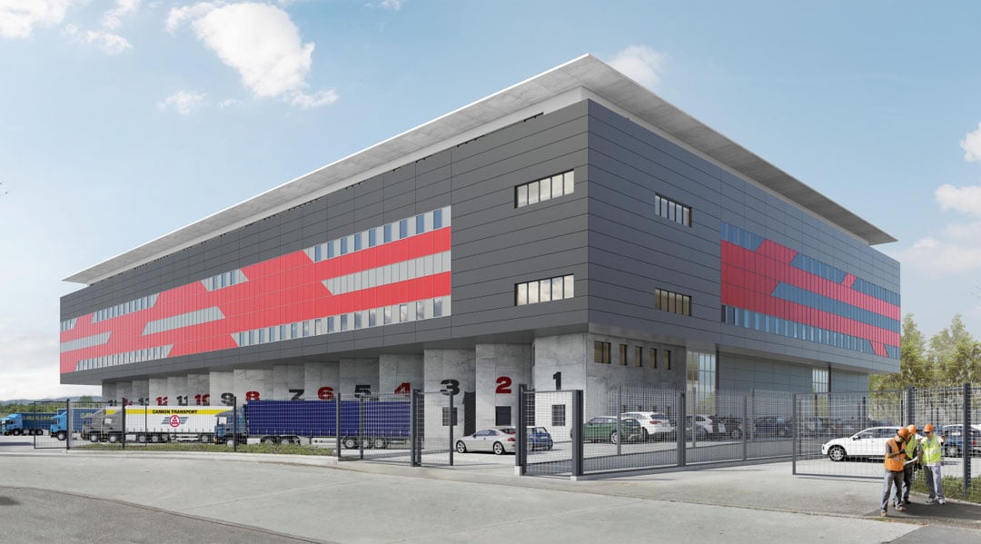 Warehouse building, modern design, large windows, red and gray color scheme, multiple trucks parked outside, fenced area, workers in orange vests