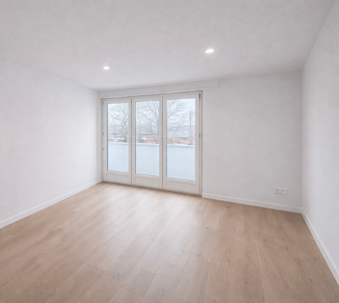 empty room, sliding glass doors, white walls, wooden floor, power outlet