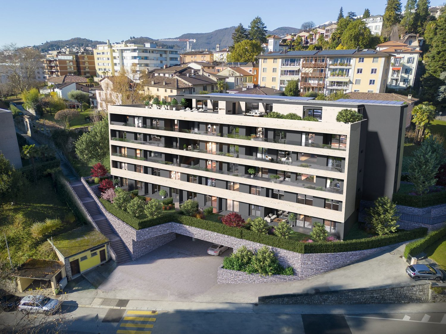 Multi-story building with multiple balconies, raised ground floor, underground garage