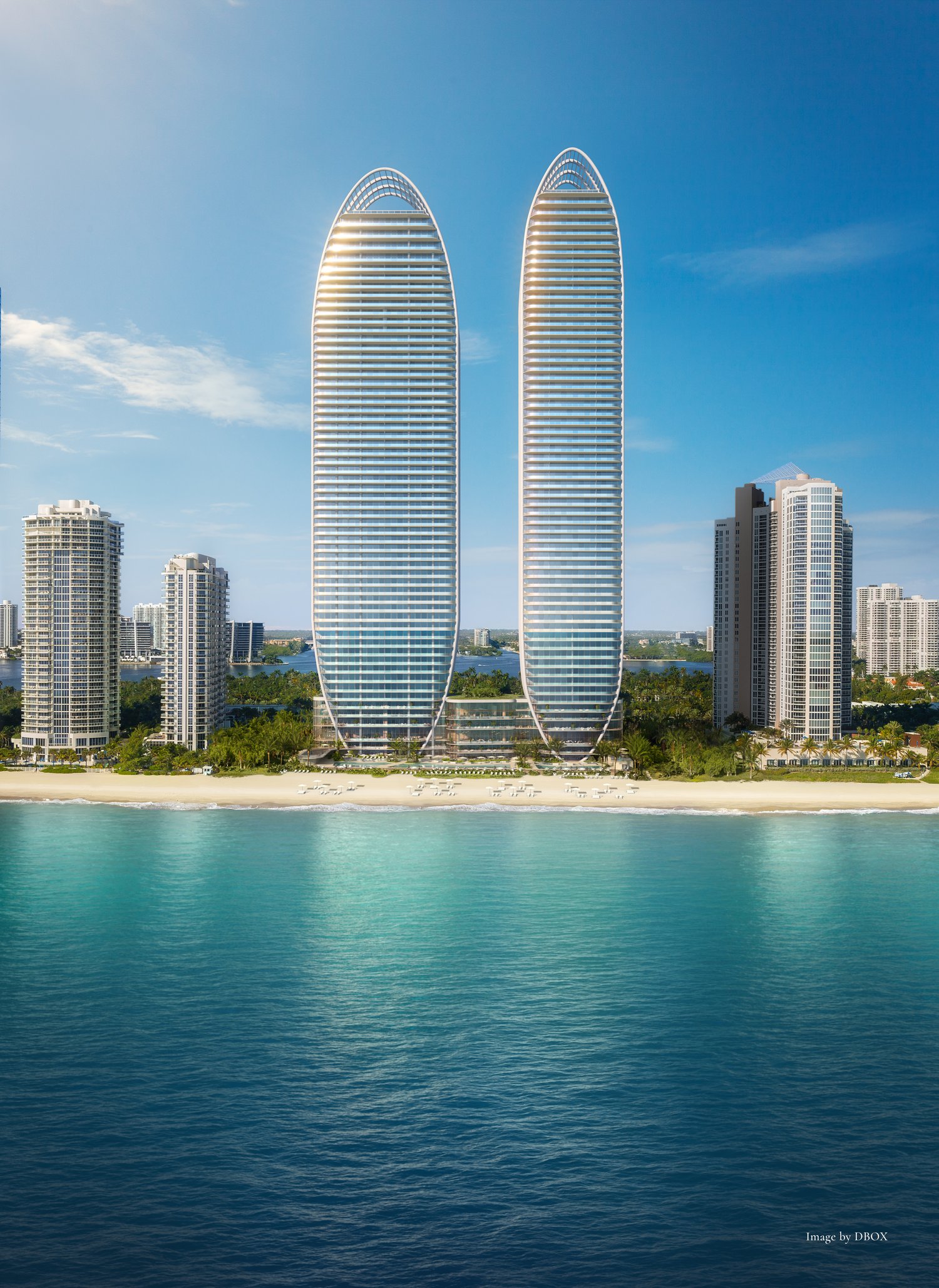 Two high-rise buildings, modern design, glass facades, located on the beach, surrounded by other buildings and greenery