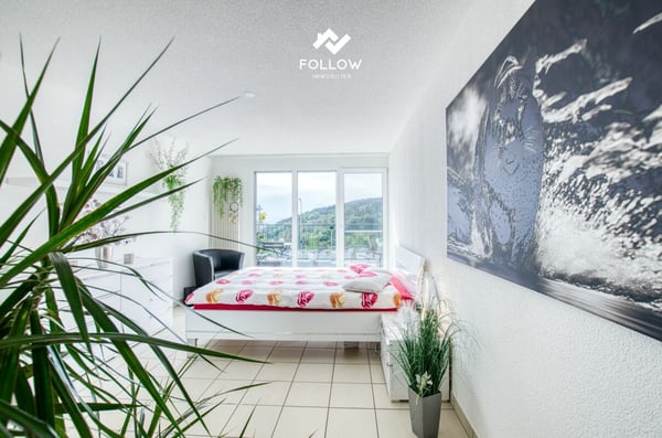 Panoramablick über den Bielersee: Modernisierte Attika-Traumwohnung in Twann 12