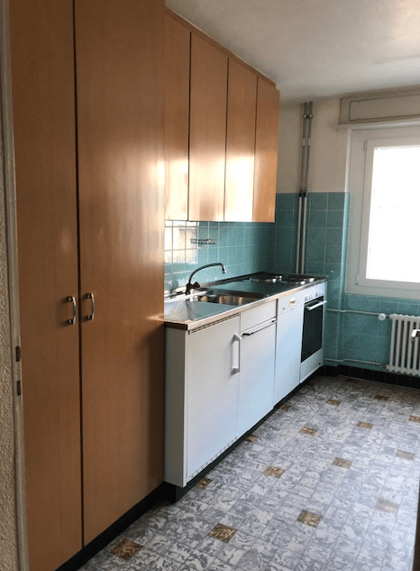 kitchen with wooden cabinets, white appliances, tiled floor, blue tiles on wall, window