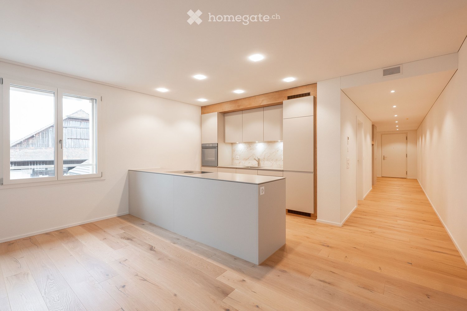 {"visible_features": [],    "type": "Room",    "description": "modern kitchen with island, white cabinets, wooden floors, large window, stainless steel appliances",    "localized_descriptions":        {        "EN": "modern kitchen with island, white
