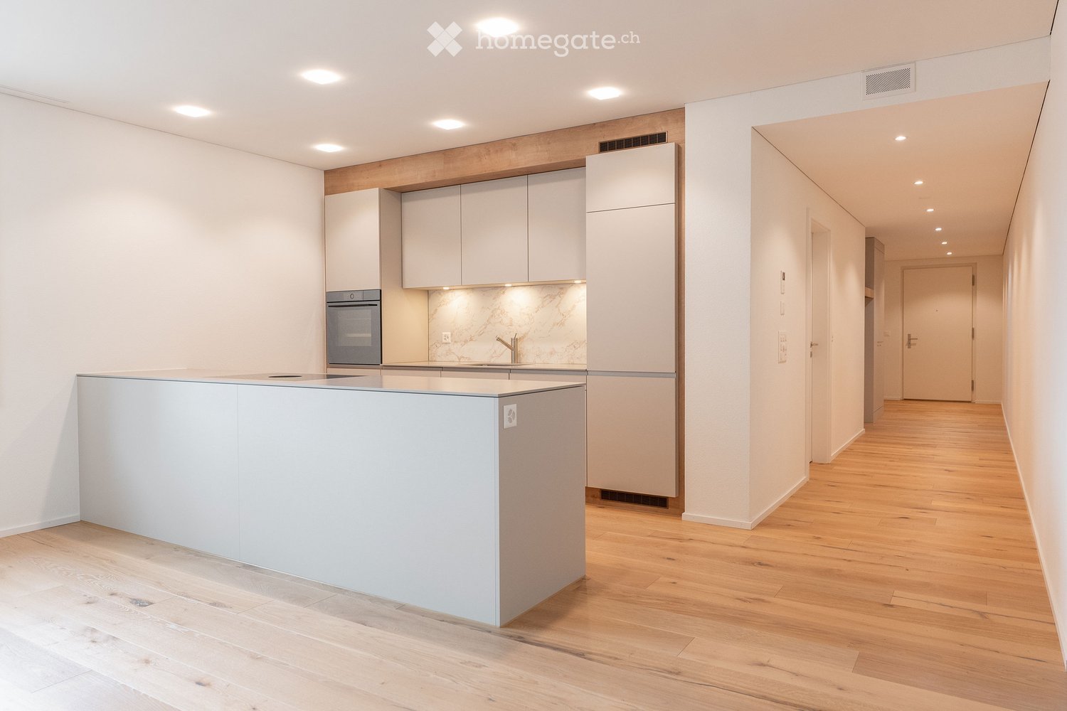 {"visible_features": [],    "type": "Room",    "description": "Kitchen with a central island, built-in oven, and wooden flooring.",    "localized_descriptions":        {        "EN": "Kitchen with a central island, built-in oven, and wooden flooring.