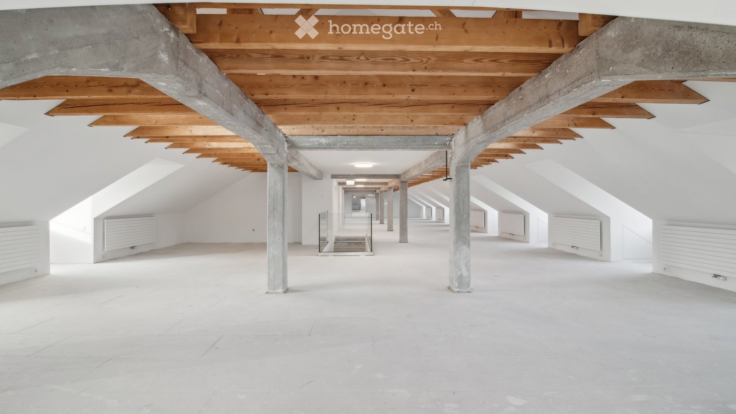 wooden beams, concrete pillars, white ceiling, white walls, glass railing, staircase, white metal heating units