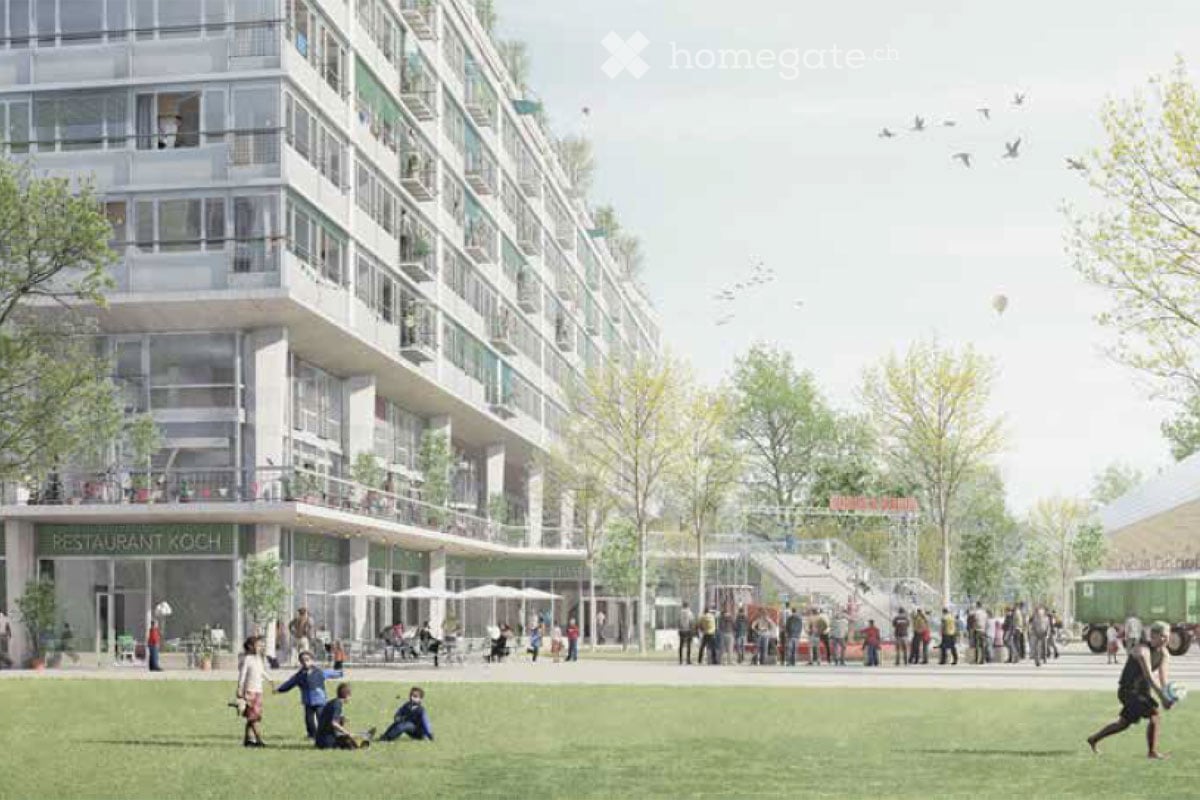 High-rise apartment building with multiple balconies, large open park area, commercial area with restaurant.