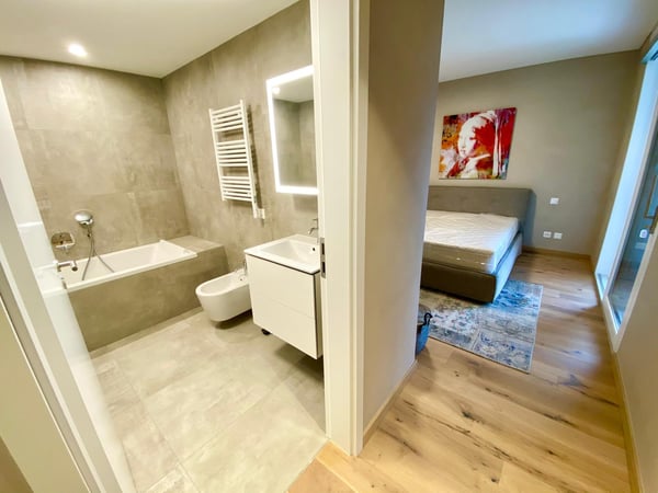 Affittasi 1.5 locali Minergie di standing superiore con grande giardino, zona barbecue + Jacuzzi 10