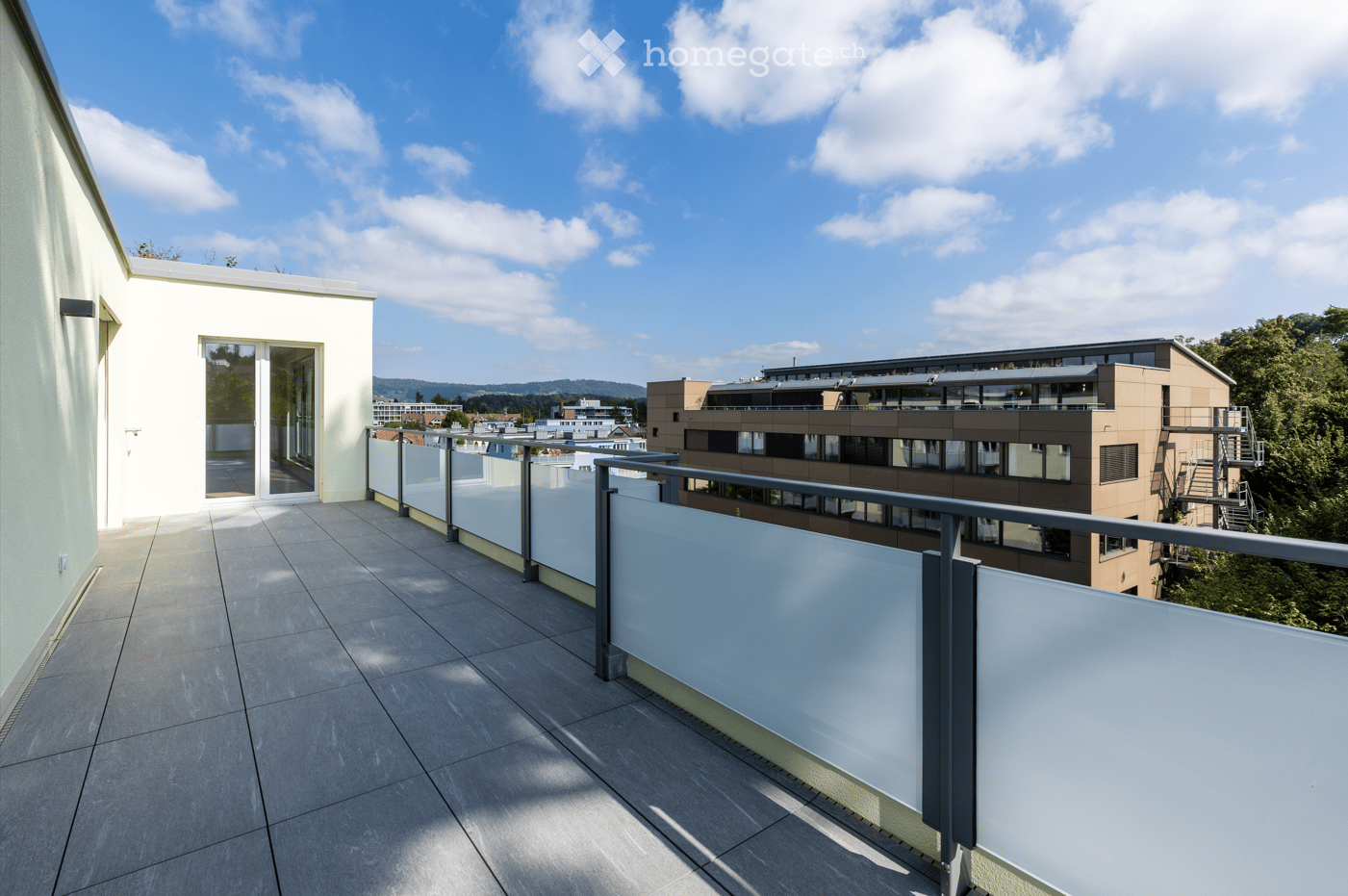 glass railings, tiled floor, wide view of the surroundings