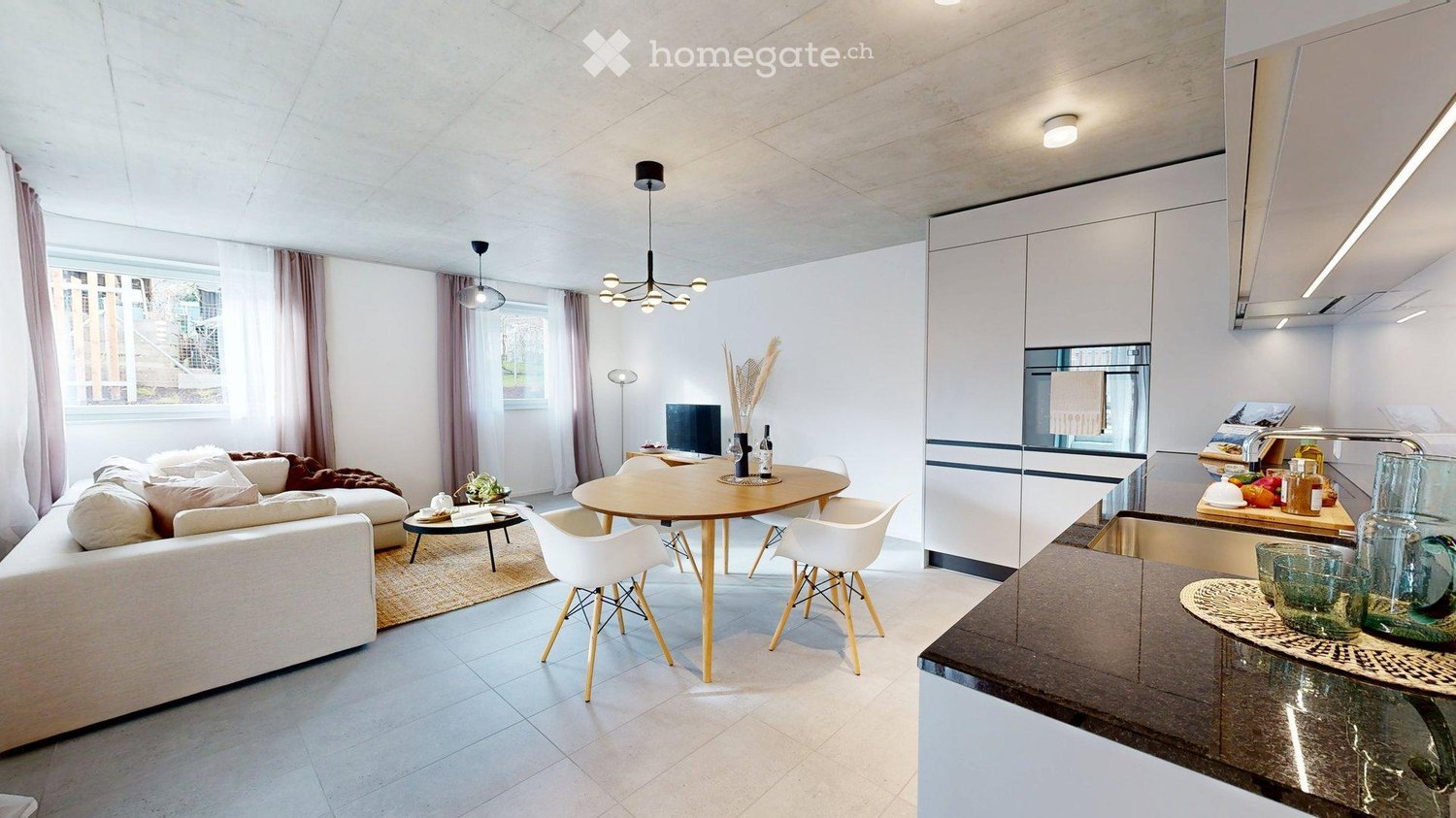 modern dining area, wooden table, white chairs, white sofa, rug, kitchen with appliances, lamps, flat screen TV