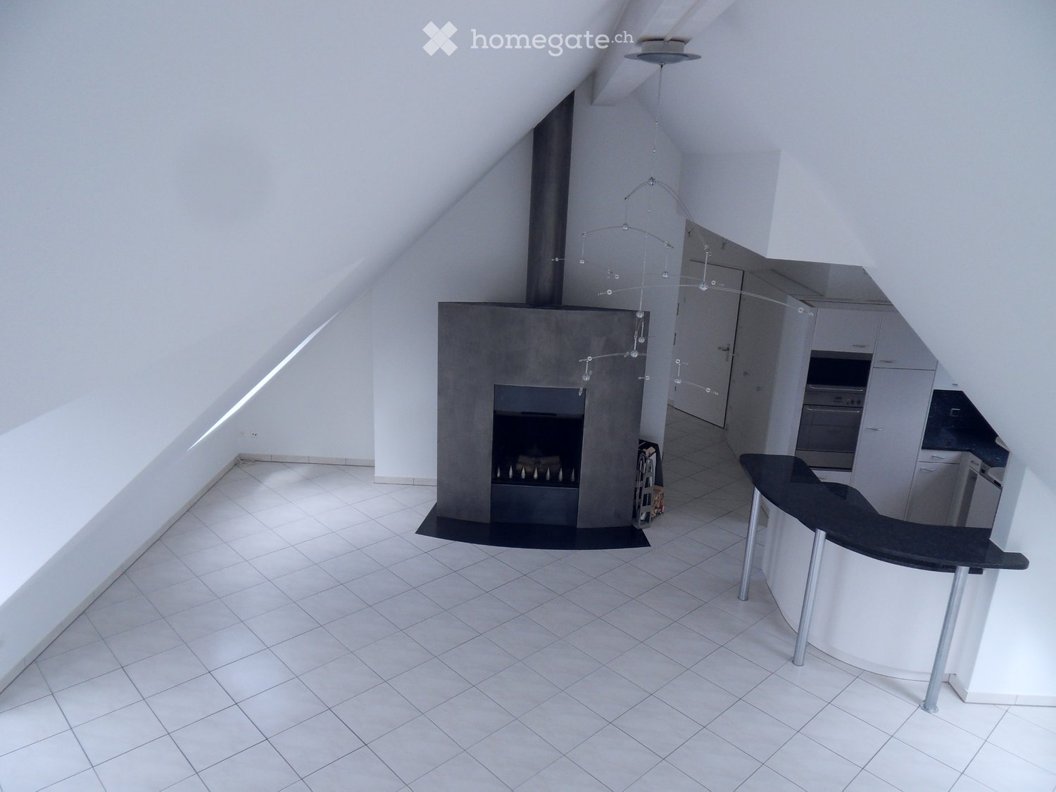 modern design, white tile floor, fireplace, white walls, modern kitchen area