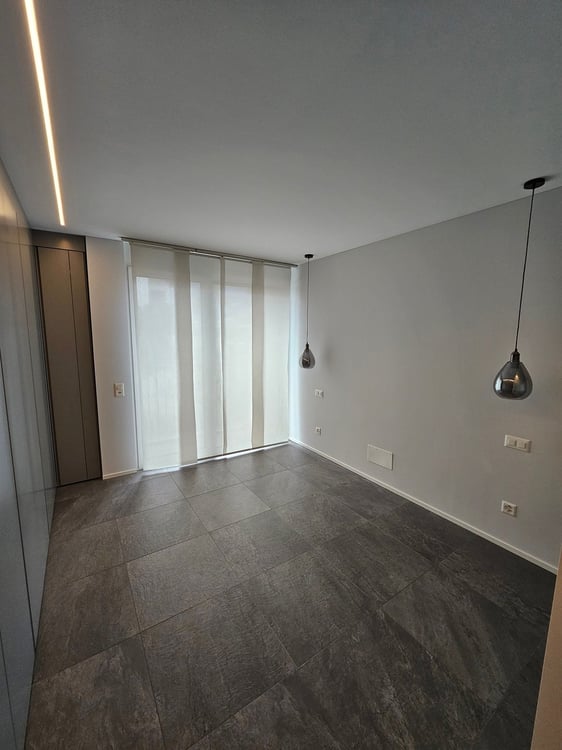 Moderno attico di 1.5 locali a Morbio Inferiore con ampio garage e posto auto esterno inclusi 2