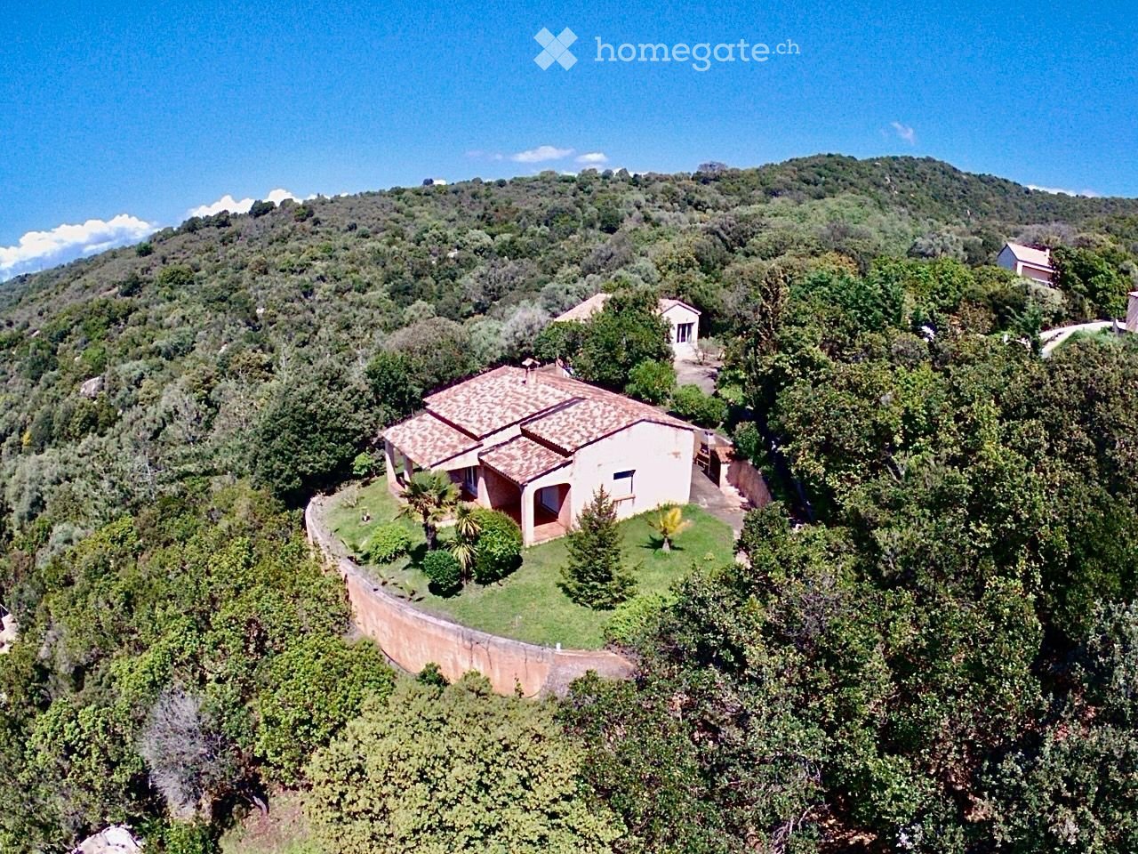 Villa on hill with a view, surrounded by trees, elevated, surrounded by greenery.