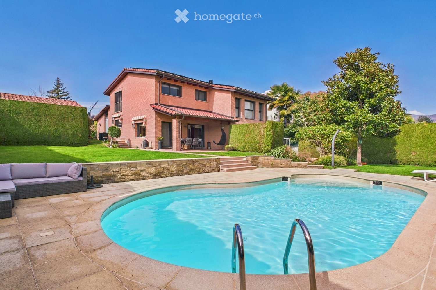 Modern house, red brick, green grass, swimming pool