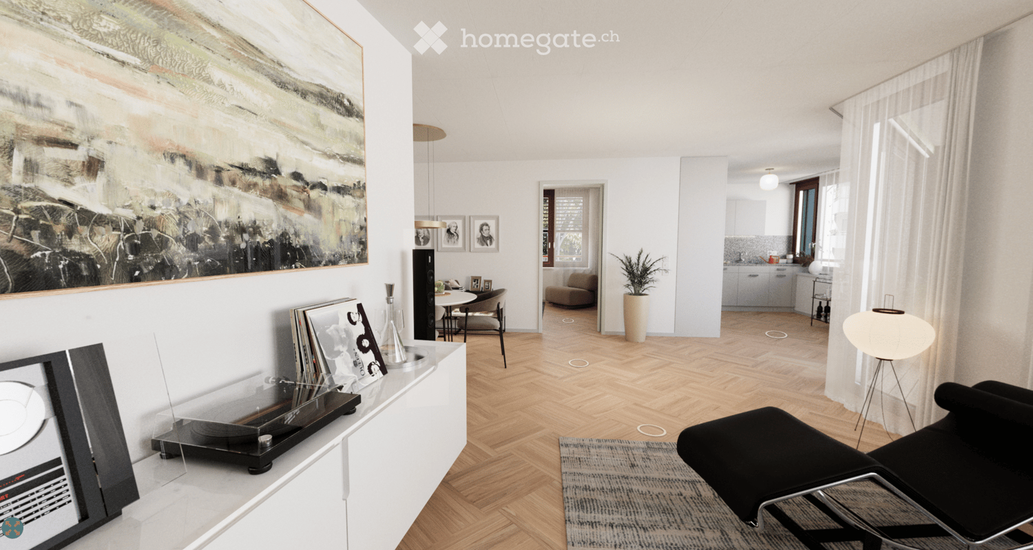 Wooden parquet floor, modern art painting, a table with a record player, a sofa and armchair, a lamp, a potted plant, and a rug.