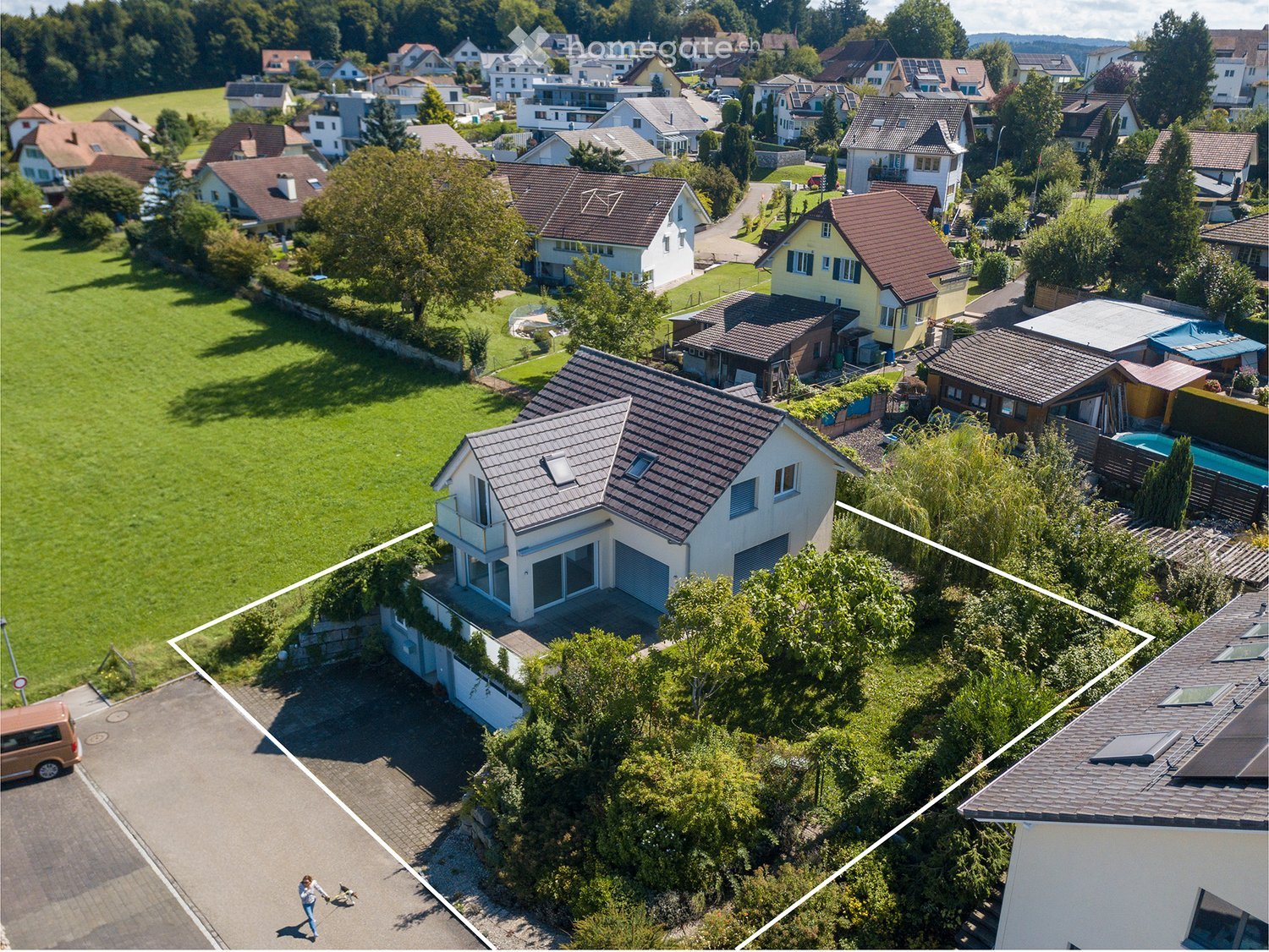 Single family house, gray roof, white walls, garage, neighboring houses, garden, swimming pool