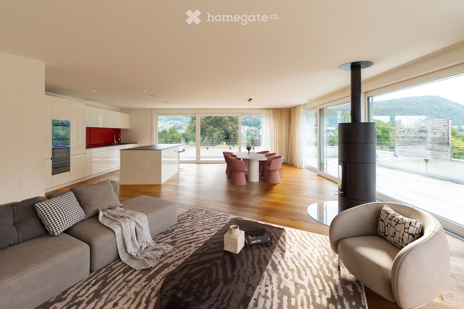modern living room, large windows, wooden floor, gray sofa, round coffee table, dining table with chairs, fireplace, kitchen with island, balcony