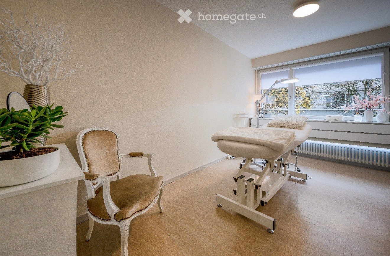 Room with bed, chair, plants, desk, lamp, radiator, windows