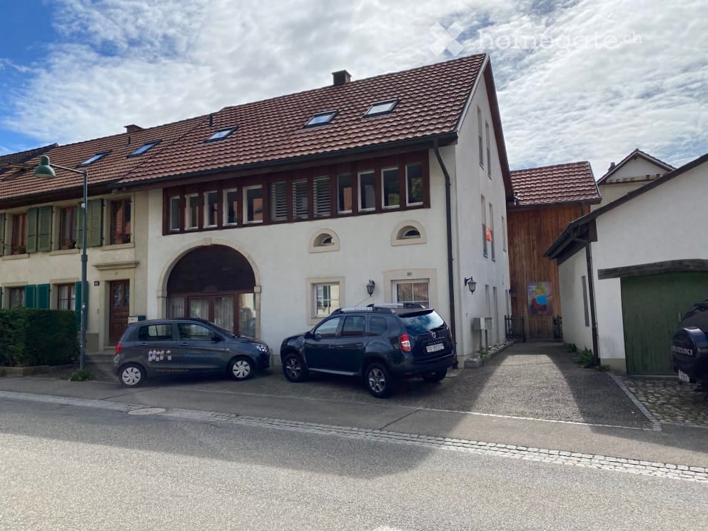 3 story house, garage, 2 cars parked