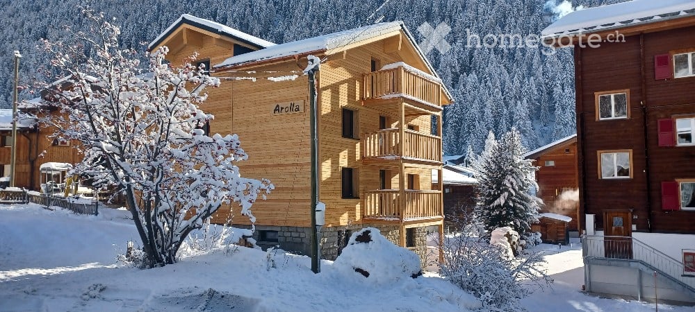 wooden house, 3 floors, balconies, snow covered