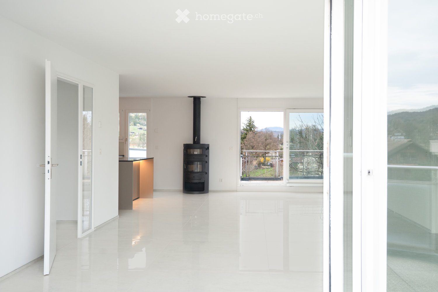 modern room, white walls, white floor, large windows, balcony, fireplace