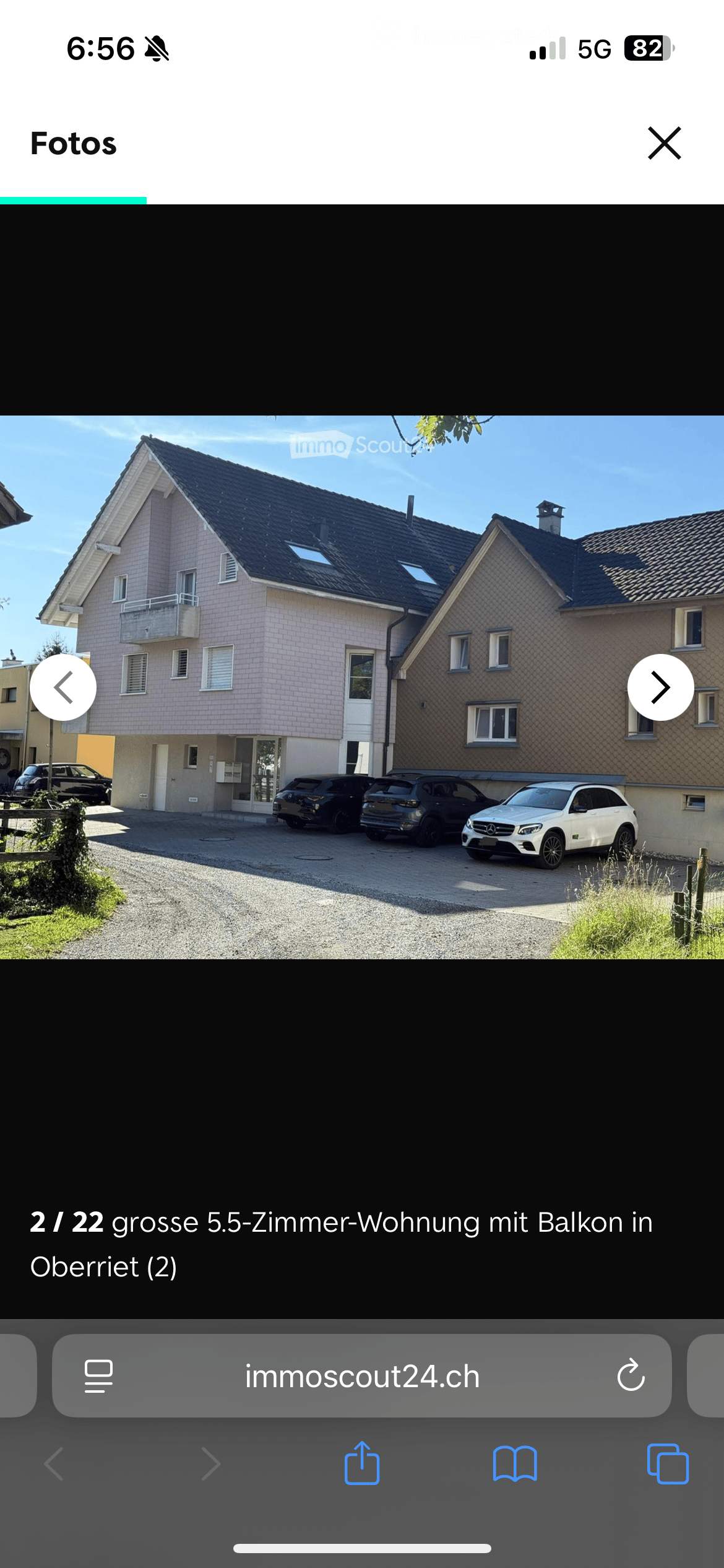2 story house, balcony, 3 cars parked in front
