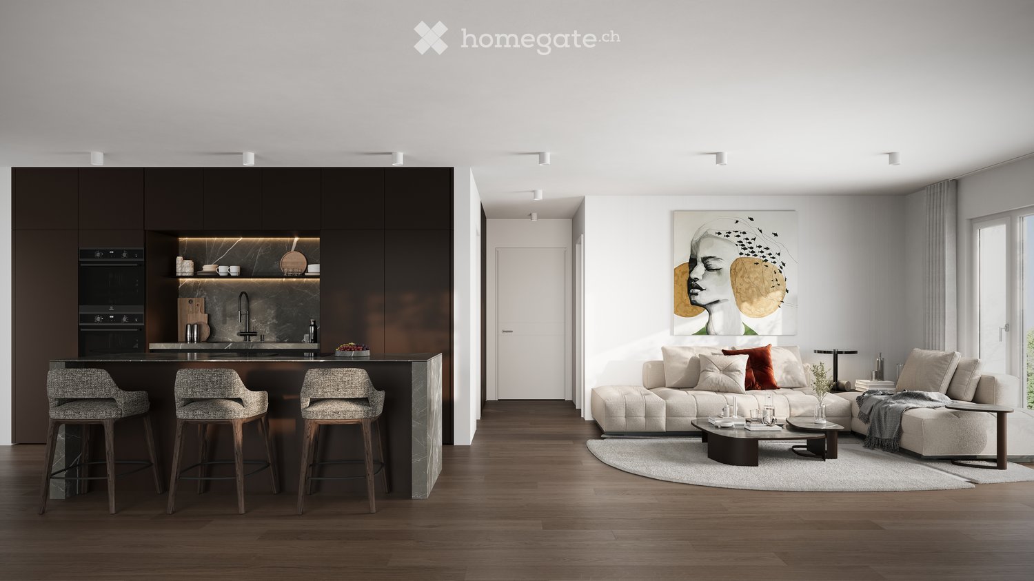 modern kitchen with island, open living room with couch, coffee table, round rug, artwork