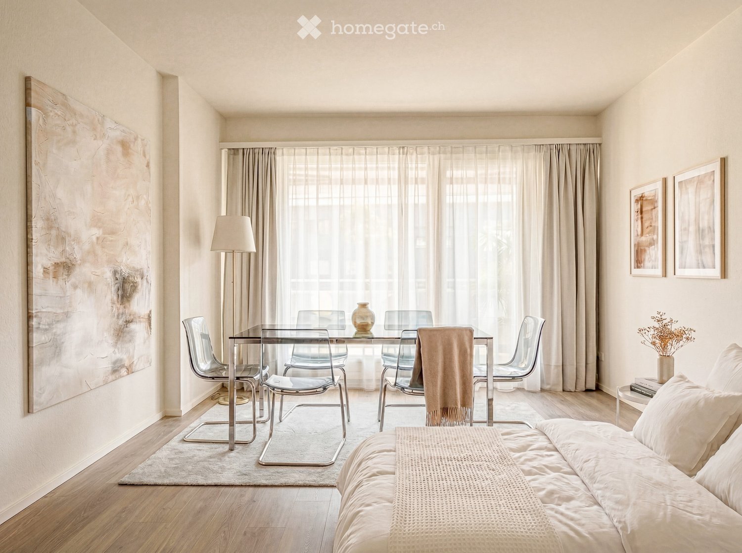 modern bedroom with a glass table, chairs, a bed, and a large window with curtains