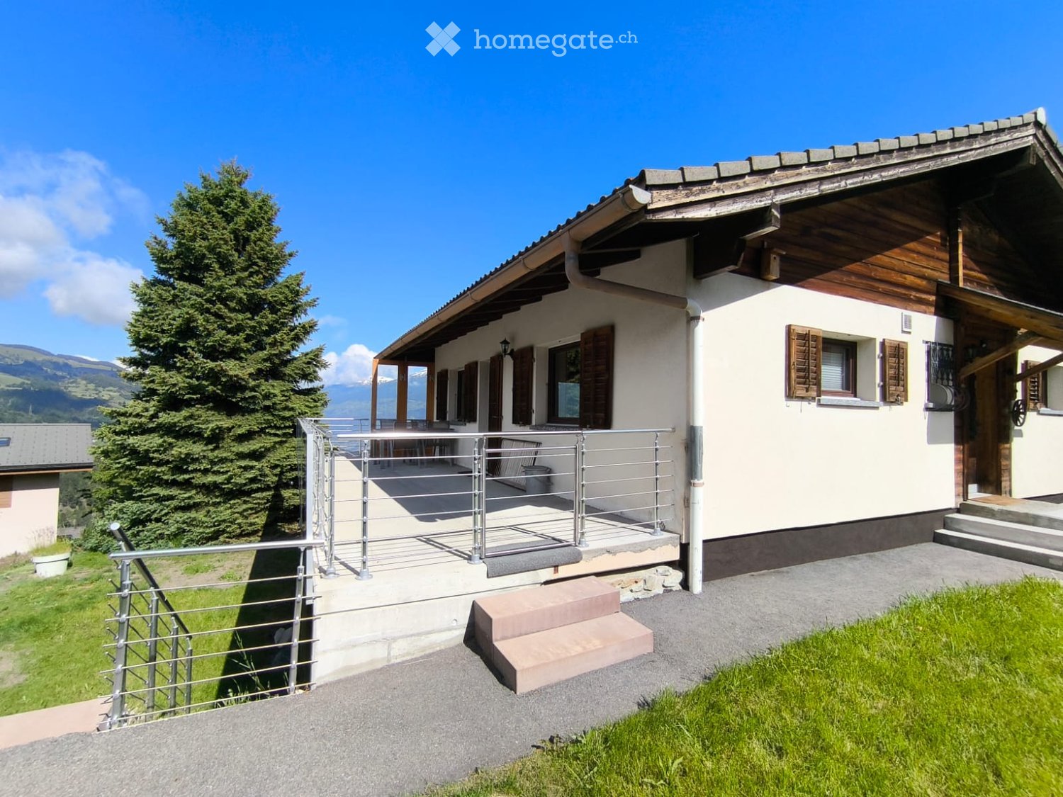 Detached house, wooden exterior, white walls, brown roof, balcony, stairs, metal railing, garden, tree