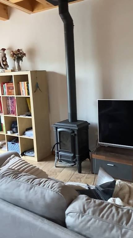 wooden floor, fireplace, couch, TV, bookshelf, wooden cabinet