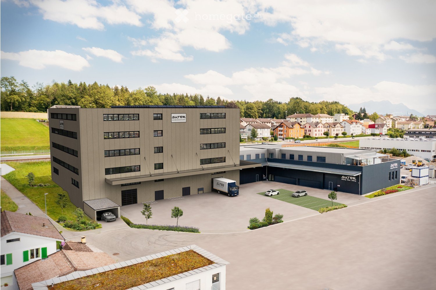 large office building, industrial style, large parking lot, several cars parked, delivery truck