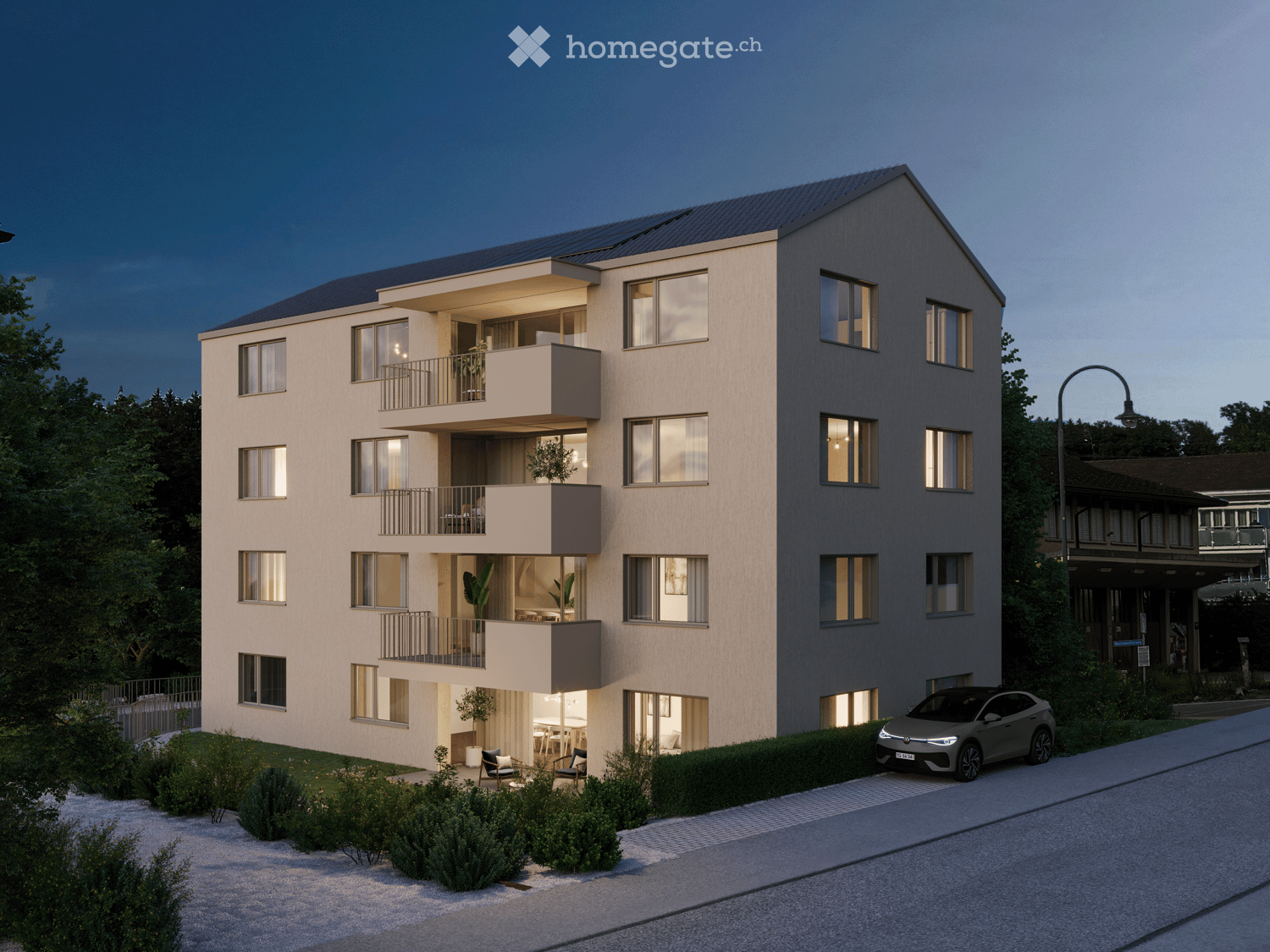4-story apartment building, beige exterior, multiple balconies, solar panels on the roof, greenery around, parked car in the front