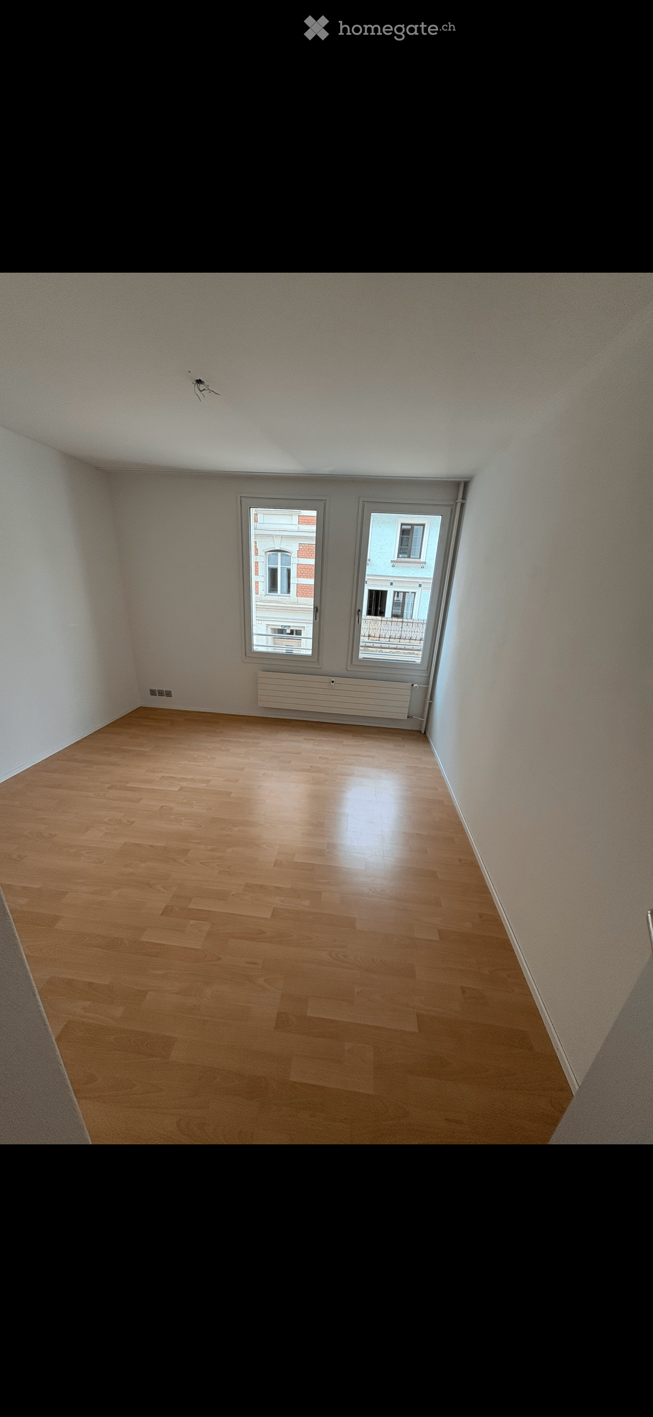 empty room, wooden floor, white walls, two windows, balcony