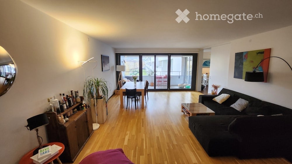 wooden floor, large windows, sliding glass doors, balcony, dining table, couch, coffee table, lamp, plants