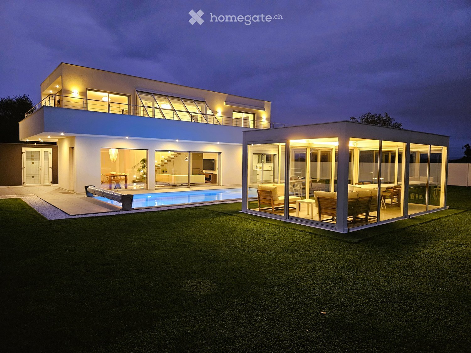 modern house, 2 stories, swimming pool, balcony, glass walls, well-lit at night